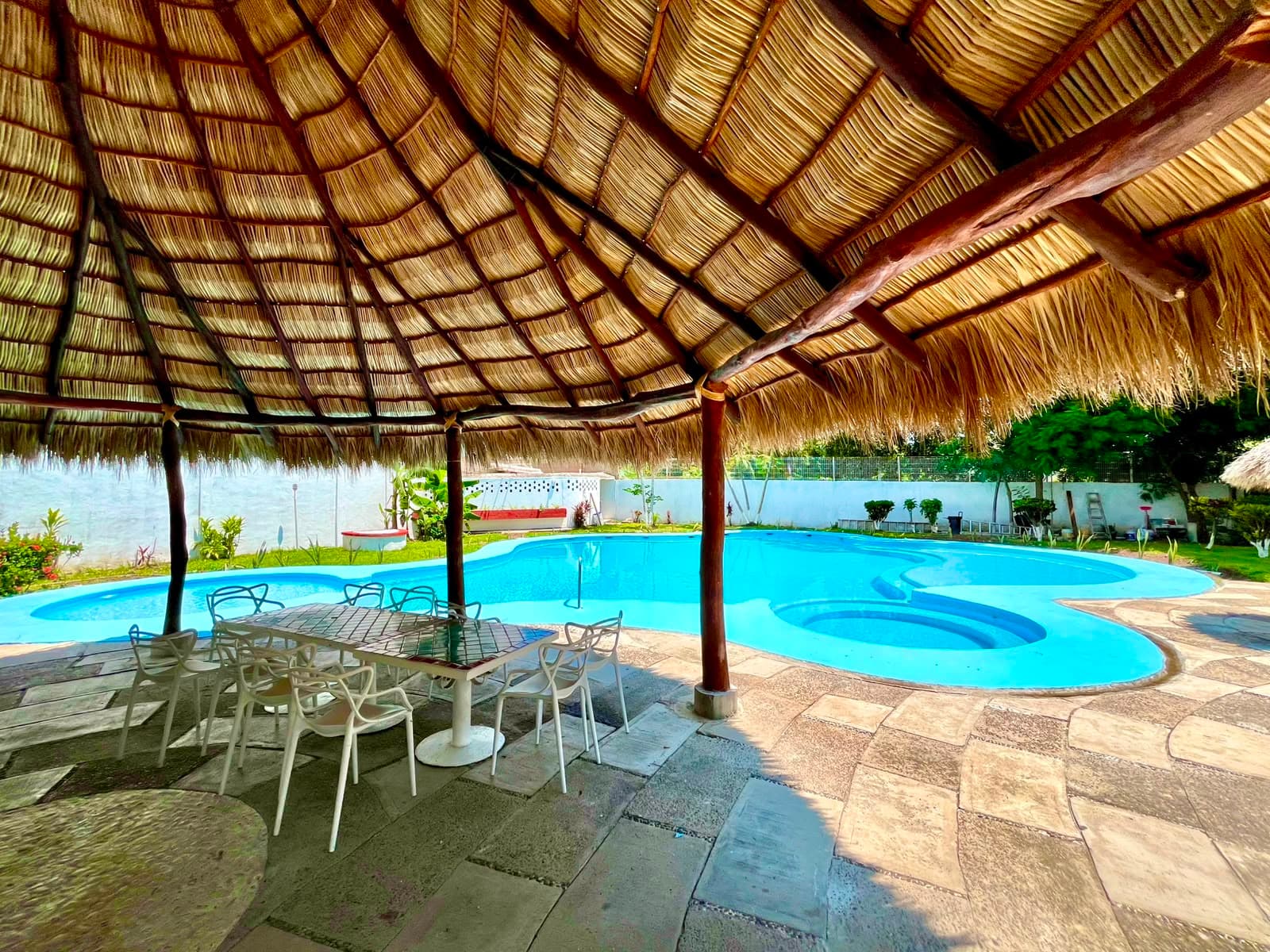 View from the palapa toward the shared pool at Mangos