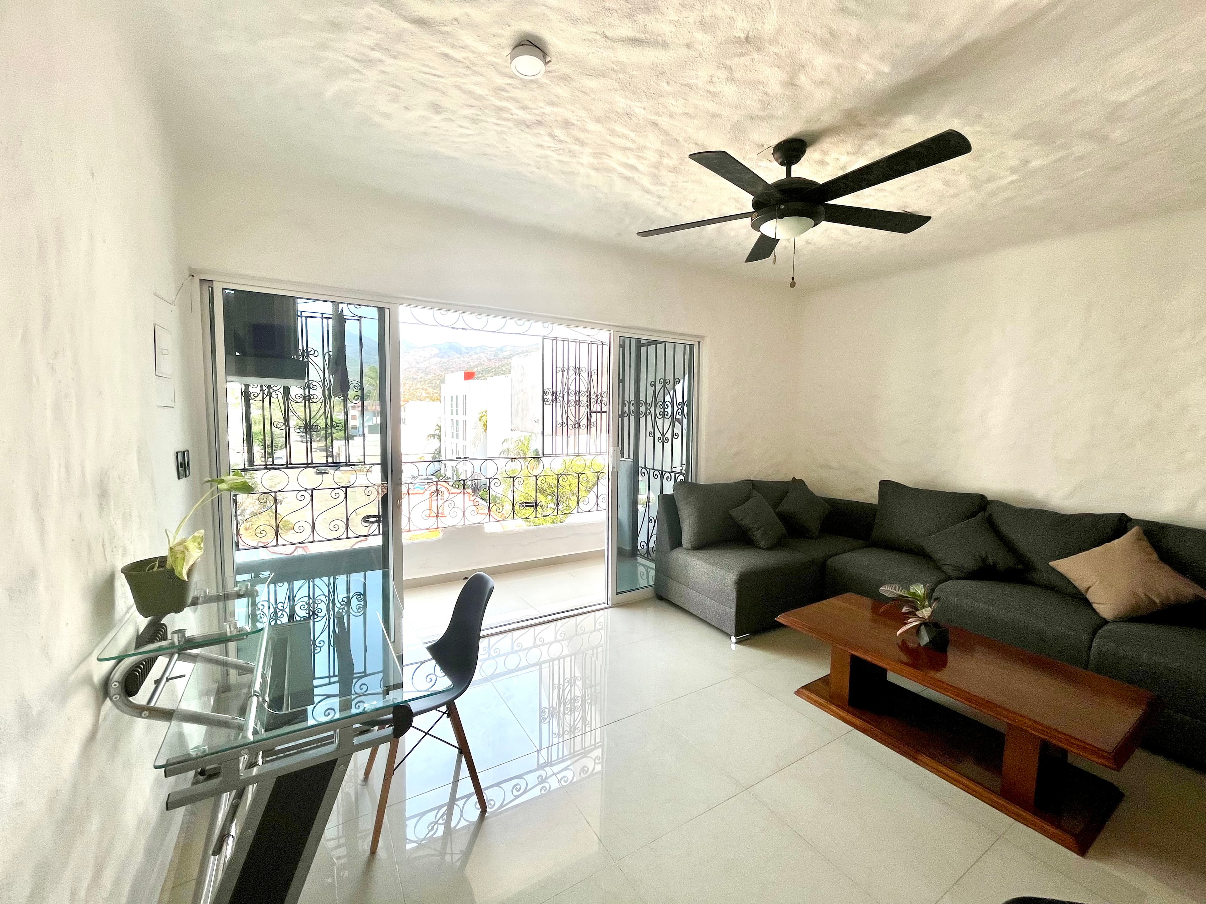 Living room opening to the exterior at Mangos