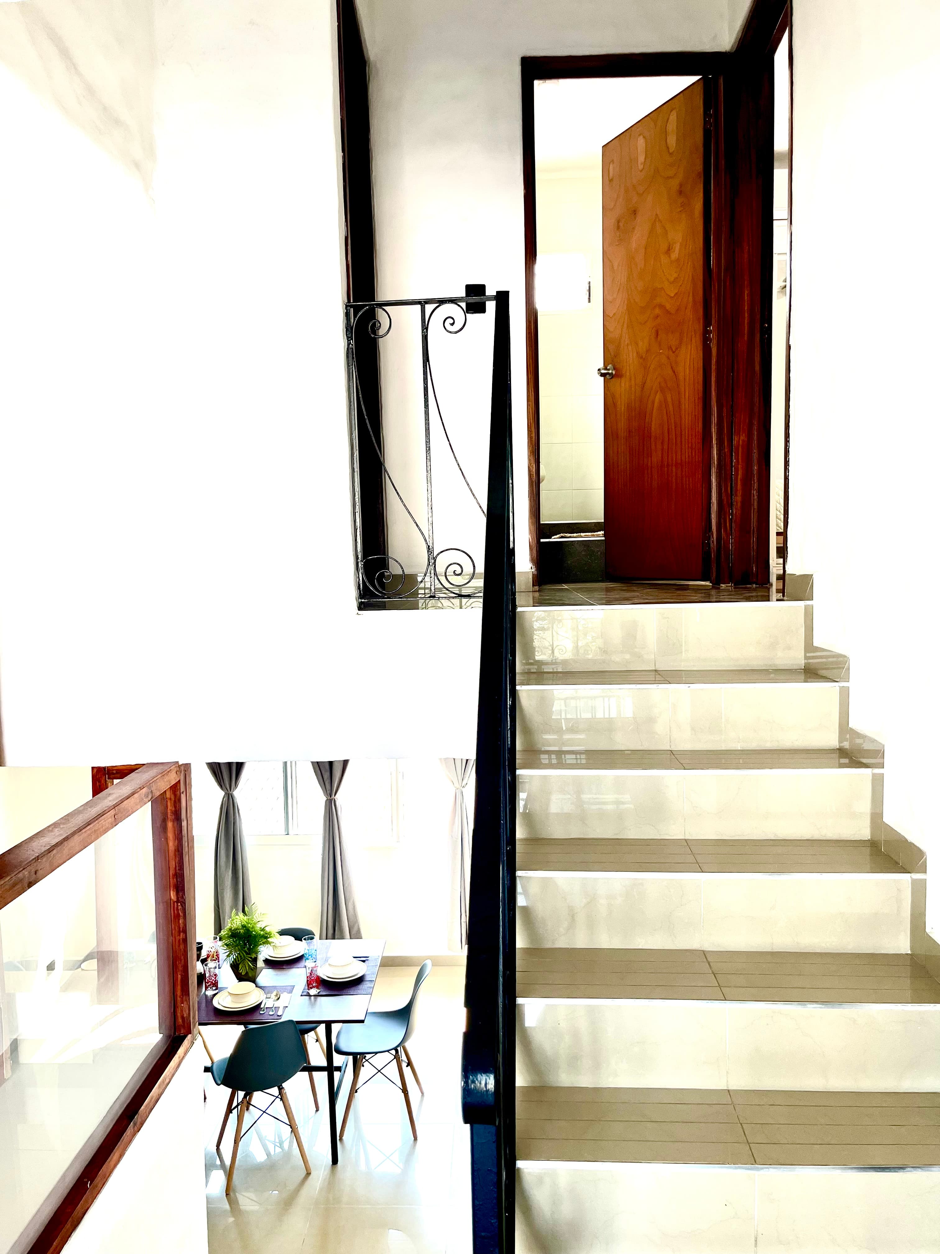 Interior stairs connecting the residence levels at Mangos