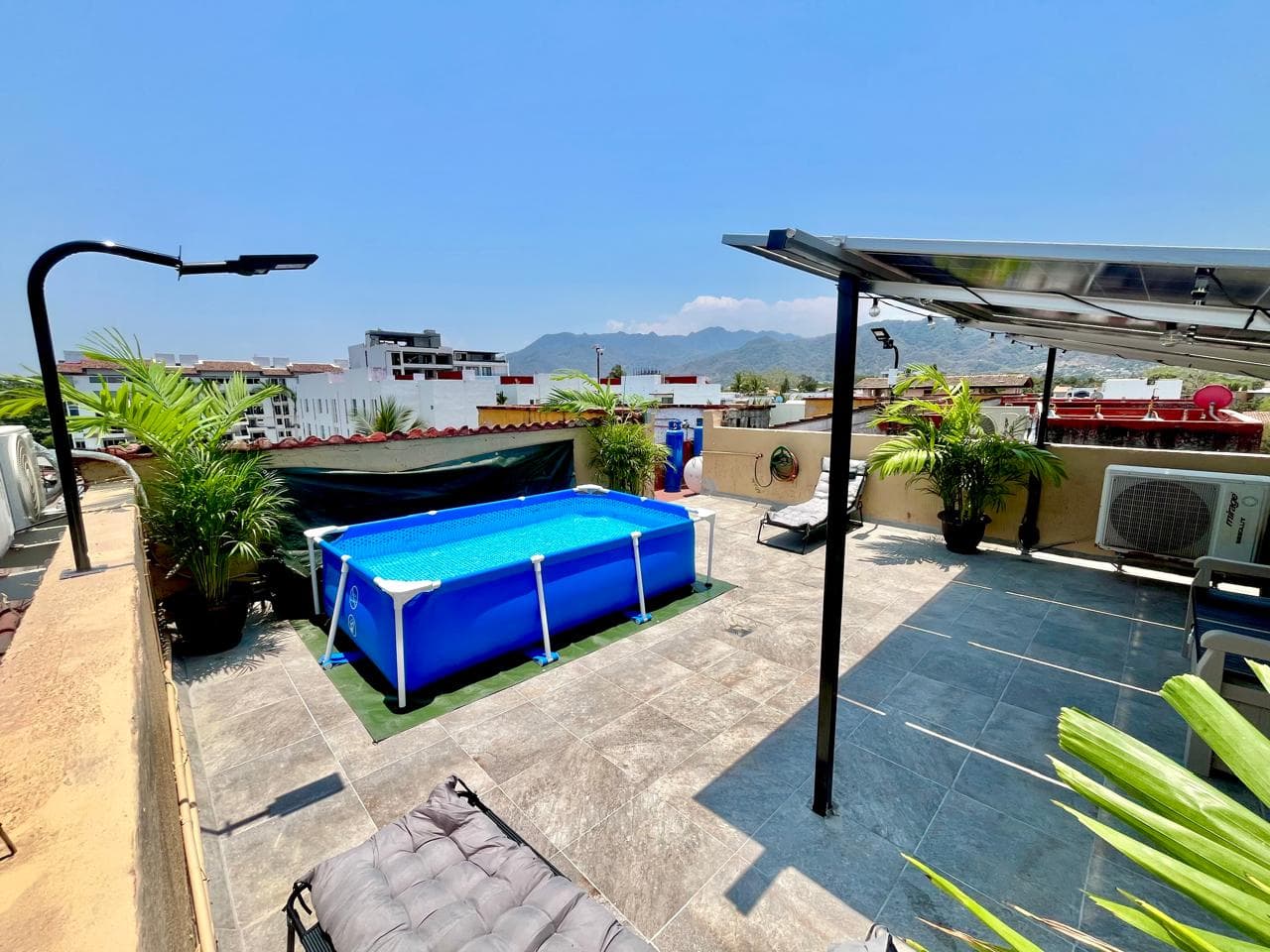 Private rooftop with plunge pool and mountain views at Versalles 837